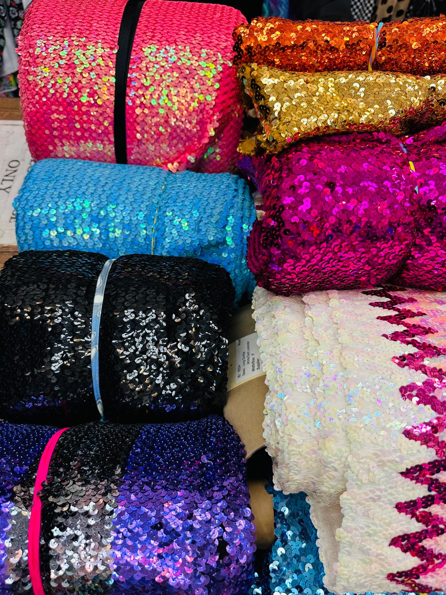 Embroidered sequins iridescent and shiny Sold by the YD. Ships worldwide from Los Angeles California USA