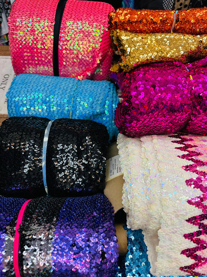 Embroidered sequins iridescent and shiny Sold by the YD. Ships worldwide from Los Angeles California USA