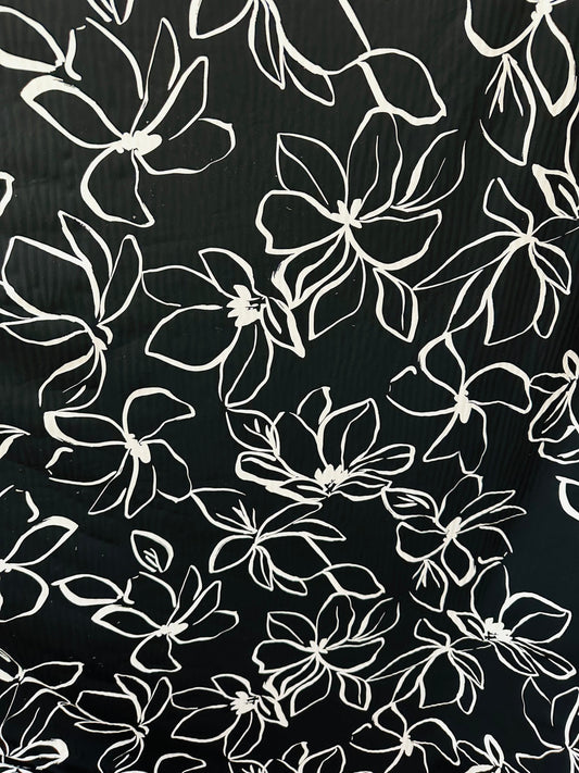 Orchid design Black/White print on great quality of nylon spandex 4-way stretch 58/60” Sold by the YD. Ships worldwide from L.A