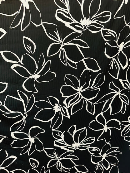 Orchid design Black/White print on great quality of nylon spandex 4-way stretch 58/60” Sold by the YD. Ships worldwide from L.A