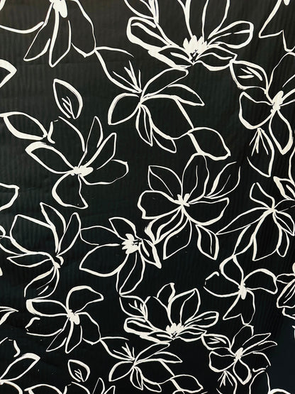 Orchid design Black/White print on great quality of nylon spandex 4-way stretch 58/60” Sold by the YD. Ships worldwide from L.A
