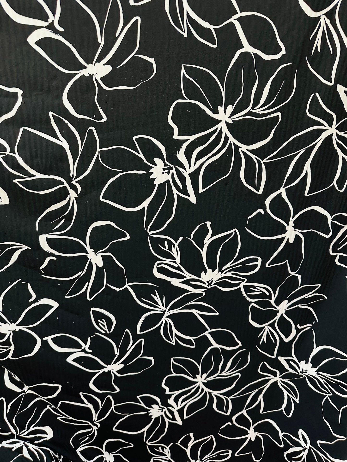 Orchid design Black/White print on great quality of nylon spandex 4-way stretch 58/60” Sold by the YD. Ships worldwide from L.A