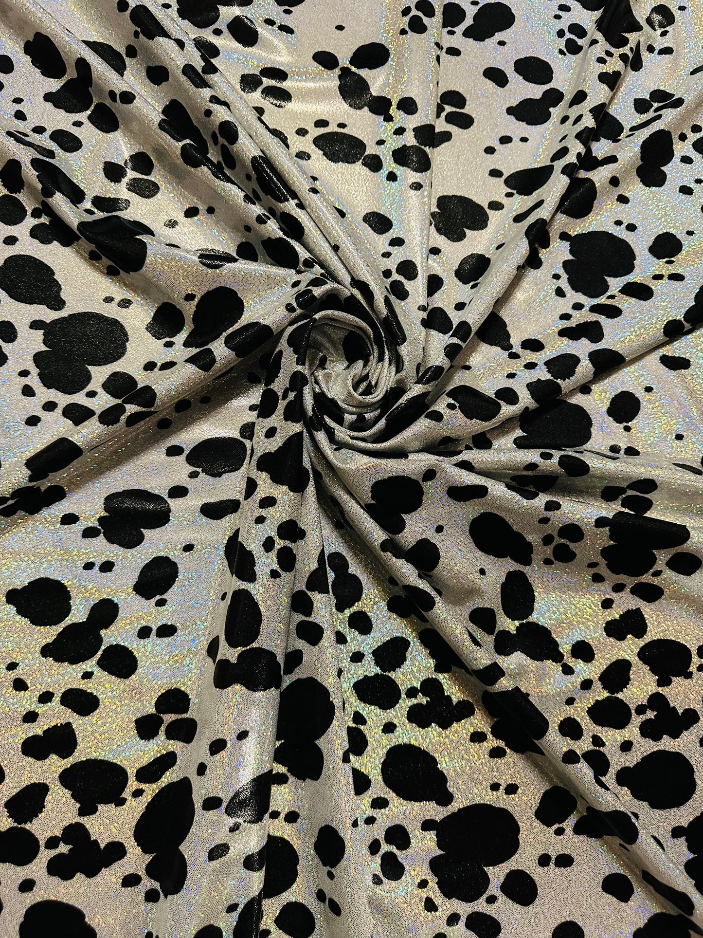 Dalmatian design on hologram foggy foil metallic nylon spandex 4-way stretch 58/60” Sold by the YD. Ships worldwide from L.A