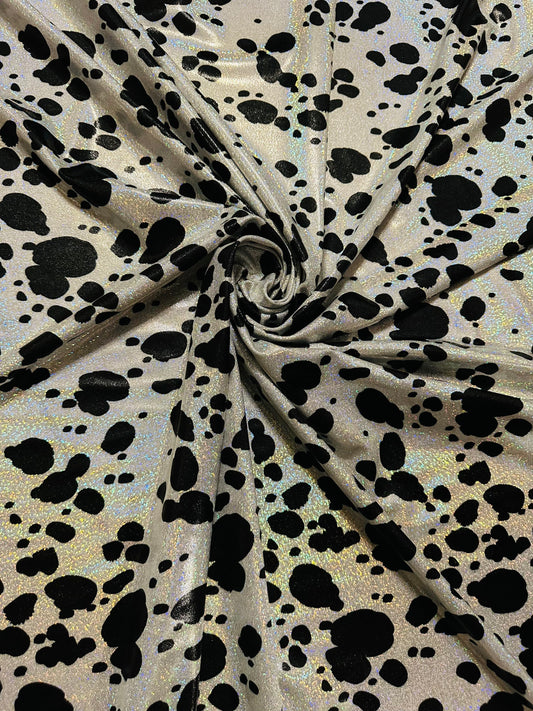 Dalmatian design on hologram foggy foil metallic nylon spandex 4-way stretch 58/60” Sold by the YD. Ships worldwide from L.A
