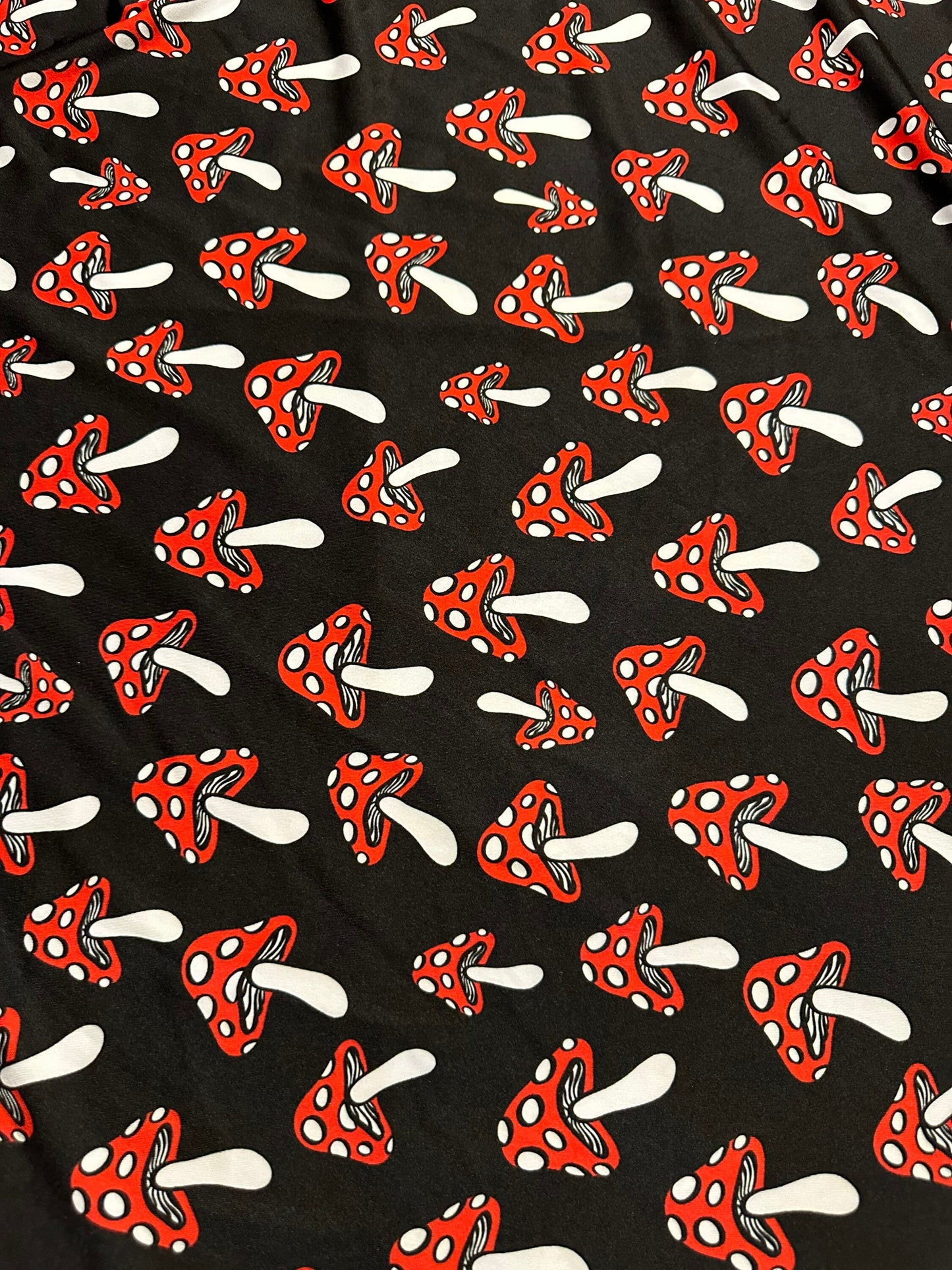 New Mushrooms designs Black/Red print on nylon spandex 4-way stretch 58/60” Sold by the YD. Ships worldwide from Los Angeles California USA