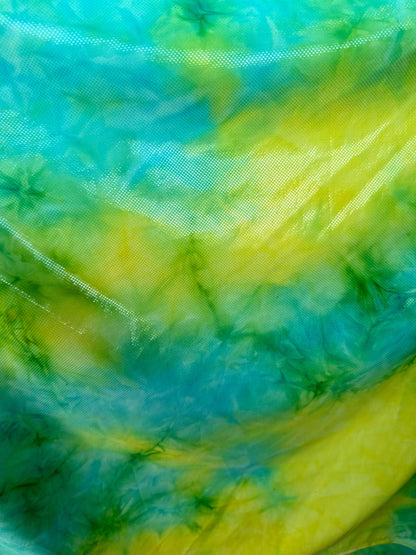 Tie dye design aqua/yellow metallic nylon spandex 4-way stretch 58/60” Sold by the YD. Ships worldwide from Los Angeles California USA
