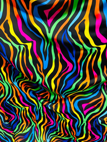 Rainbow zebra design print on nylon spandex with foil and without foil 4way stretch 58/60” Sold by the YD. Ships worldwide from Los Angeles