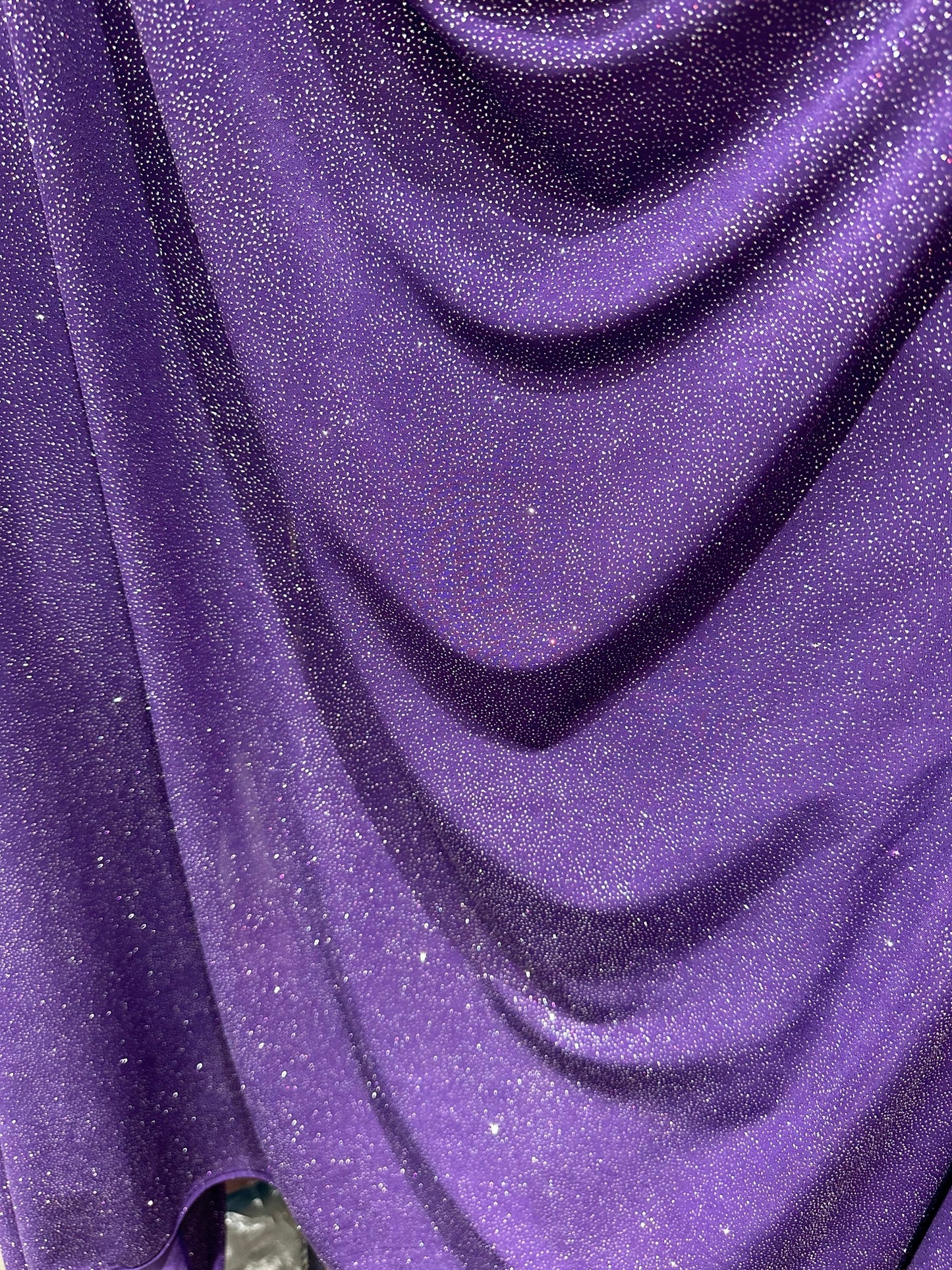Selena design eggplant/silver poly spandex with glitter 4-way stretch 58/60” Sold by the YD. Ships worldwide from Los Angeles California USA