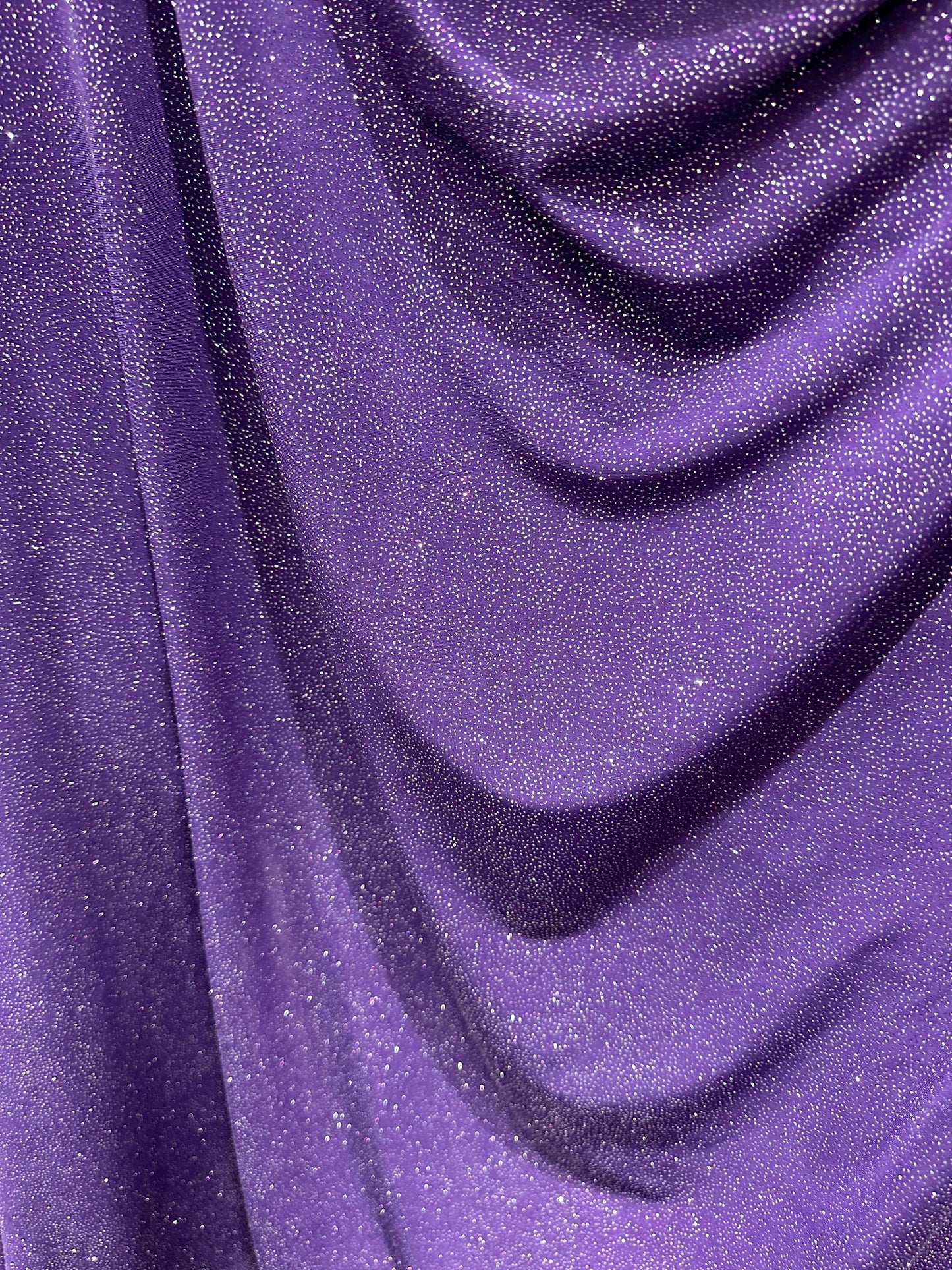 Selena design eggplant/silver poly spandex with glitter 4-way stretch 58/60” Sold by the YD. Ships worldwide from Los Angeles California USA
