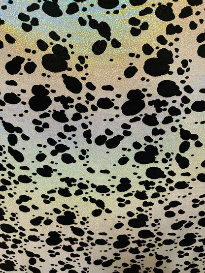 Dalmatian design on hologram foggy foil metallic nylon spandex 4-way stretch 58/60” Sold by the YD. Ships worldwide from L.A