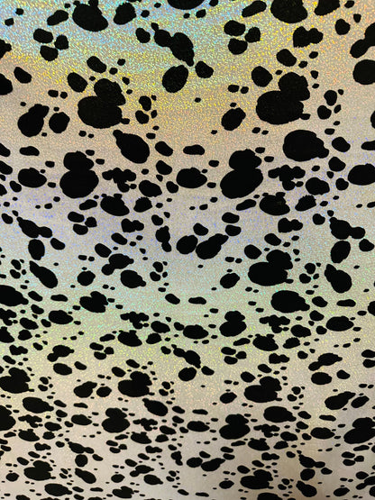 Dalmatian design on hologram foggy foil metallic nylon spandex 4-way stretch 58/60” Sold by the YD. Ships worldwide from L.A