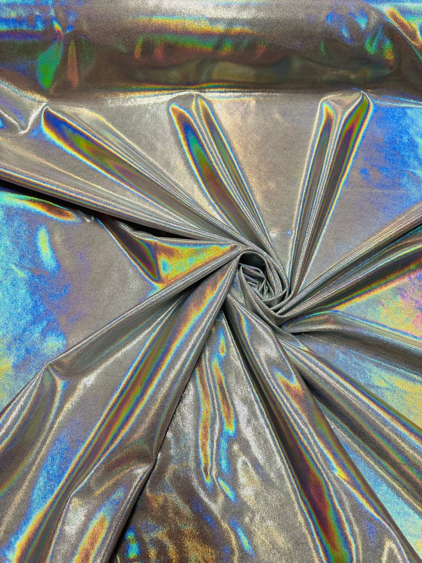 Oil slick design iridescent white silver foggy foil hologram metallic nylon spandex 4-way stretch 58/60” Sold by the YD.