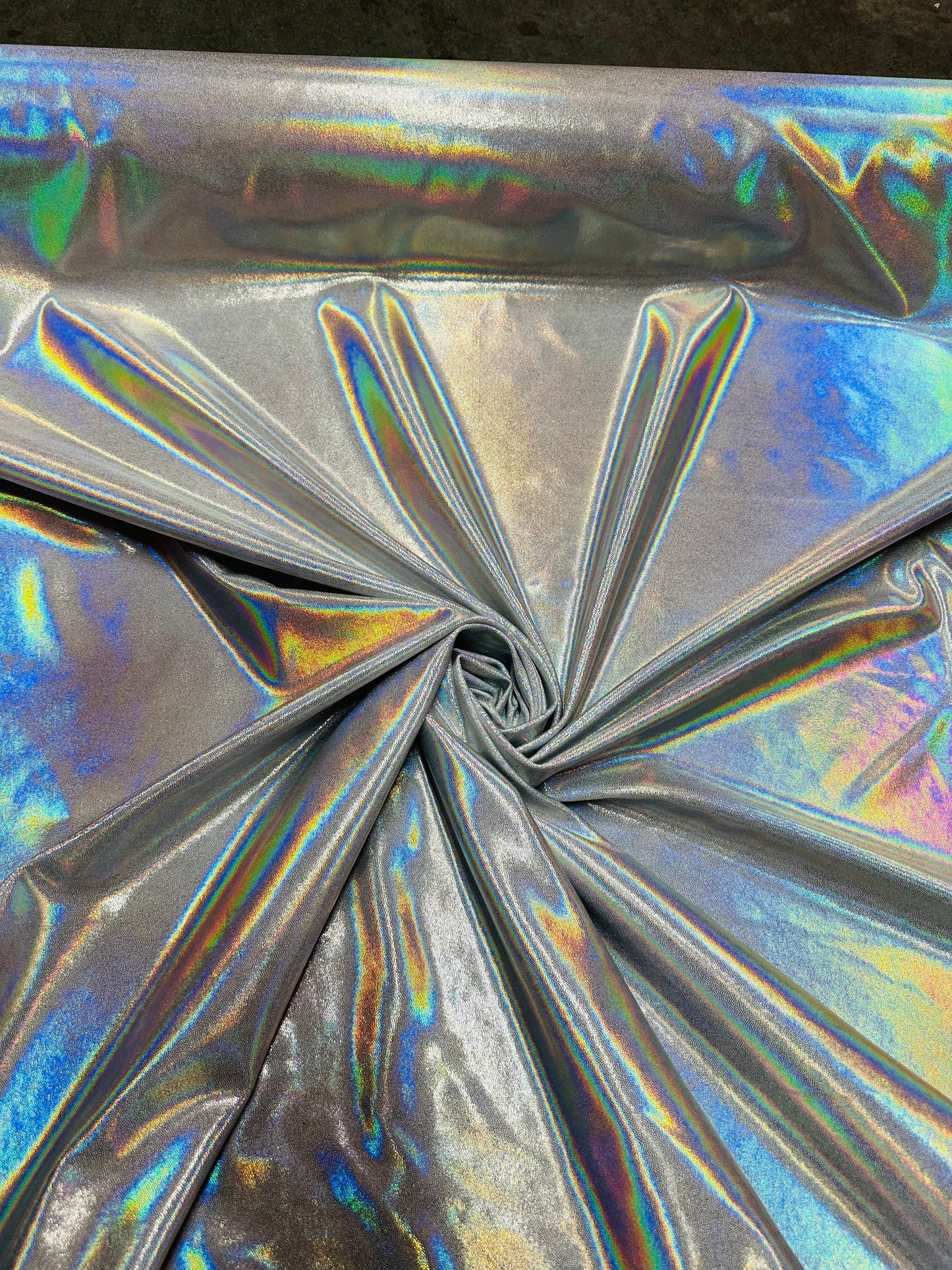 Oil slick design iridescent white silver foggy foil hologram metallic nylon spandex 4-way stretch 58/60” Sold by the YD.