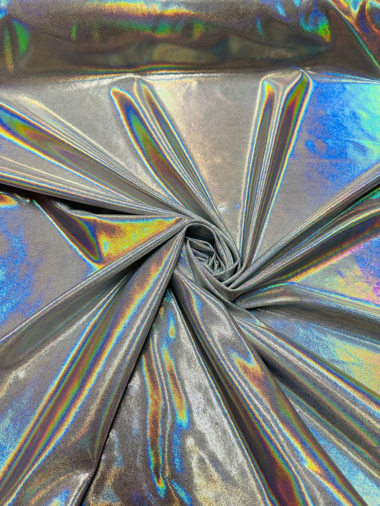Oil slick design iridescent white silver foggy foil hologram metallic nylon spandex 4-way stretch 58/60” Sold by the YD.