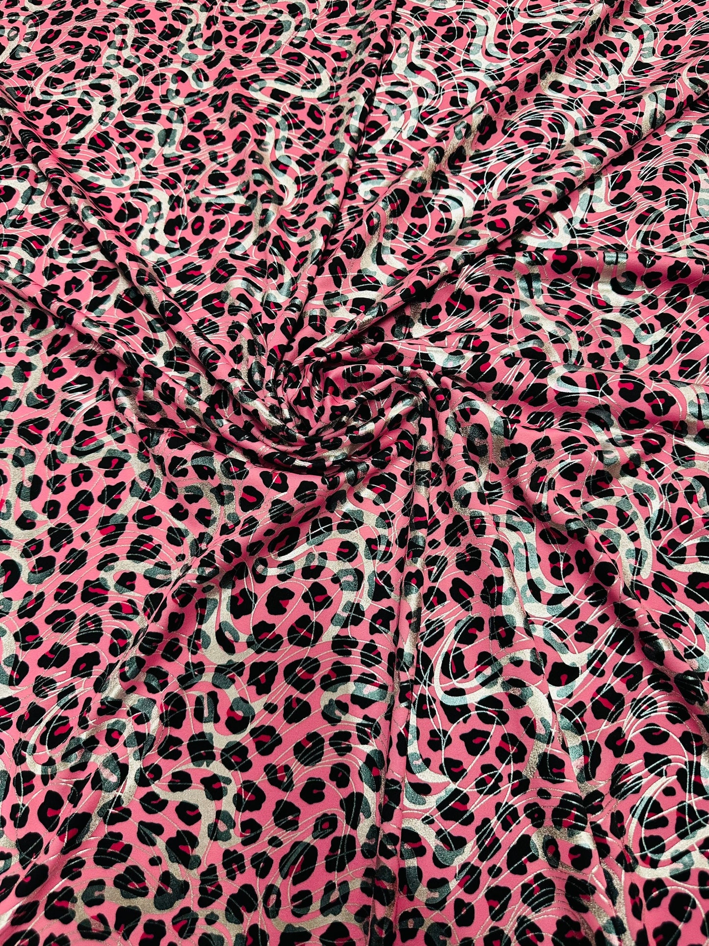 Cheetah design metallic nylon spandex 4-way stretch 58/60” Sold by the YD. Ships worldwide from Los Angeles California USA