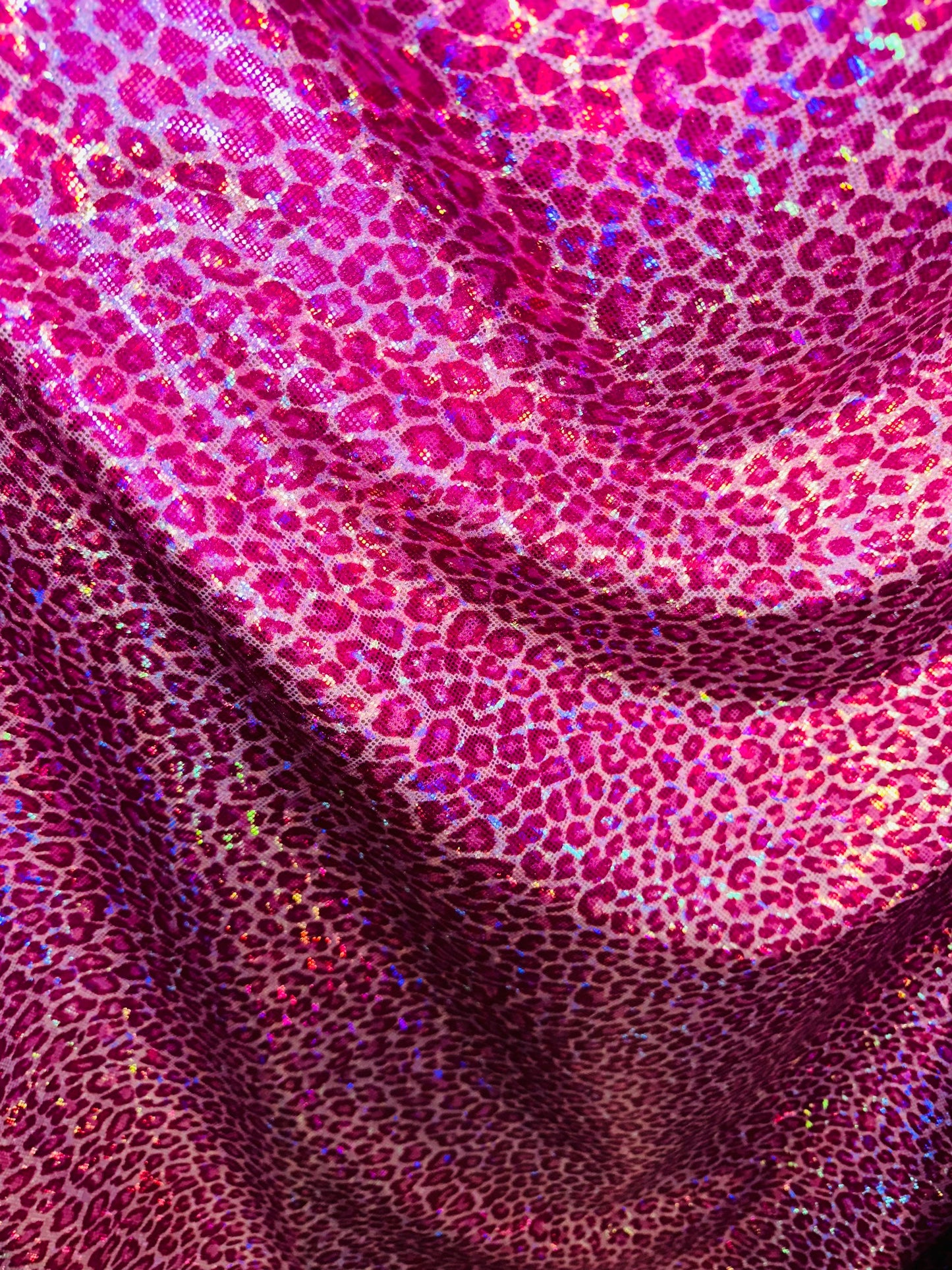 Wild Cheetah design on shattered glass hologram metallic nylon spandex 4-way stretch 58/60” Sold by the YD