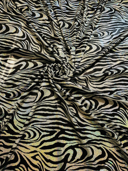 Wild Zebra design hologram metallic nylon spandex with iridescent foggy foil 58/60” 4-way stretch.