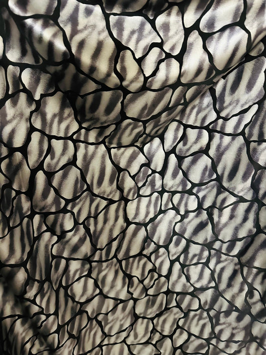 Giraffe abstract design metallic nylon spandex;-way stretch 58/60” Sold by the YD. Ships worldwide from Los Angeles California USA