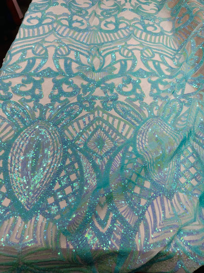 New Luxury Jlo sequins design Tiffany blue embroidered on stretch power mesh  4-way stretch 55/57” Sold by the YD. Ships worldwide from L.A