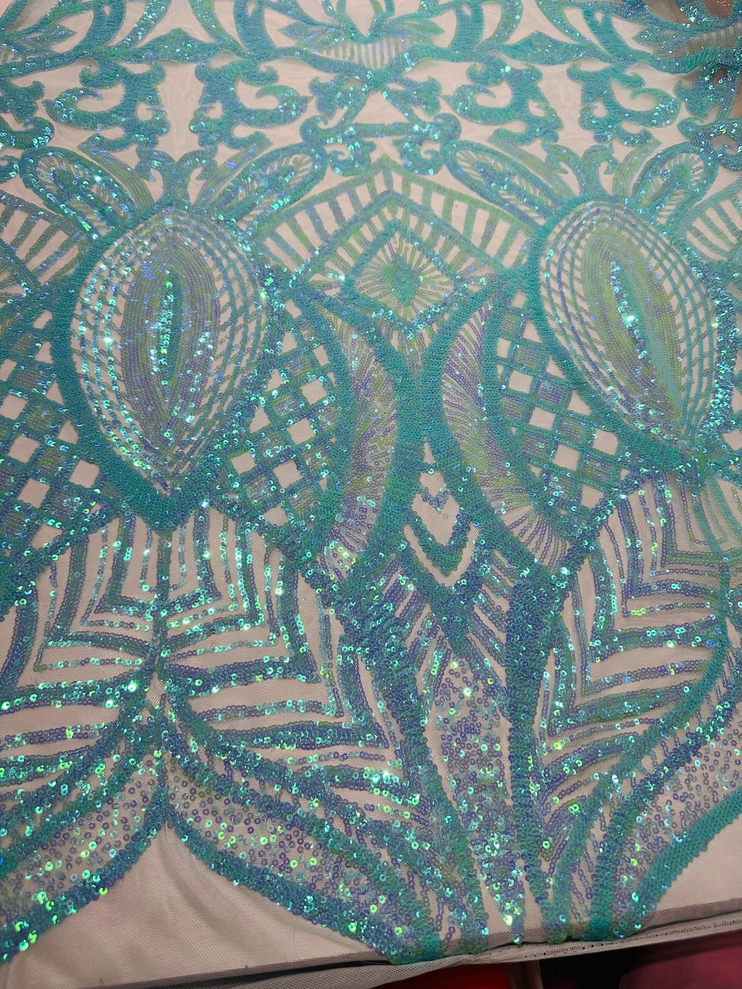 New Luxury Jlo sequins design Tiffany blue embroidered on stretch power mesh  4-way stretch 55/57” Sold by the YD. Ships worldwide from L.A