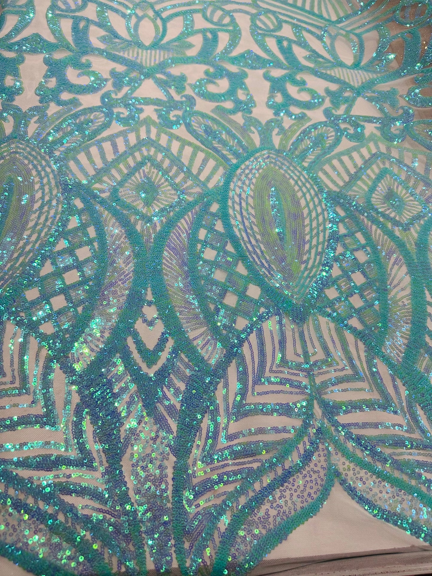 New Luxury Jlo sequins design Tiffany blue embroidered on stretch power mesh  4-way stretch 55/57” Sold by the YD. Ships worldwide from L.A