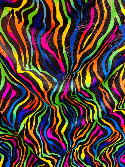 Rainbow zebra design print on nylon spandex with foil and without foil 4way stretch 58/60” Sold by the YD. Ships worldwide from Los Angeles