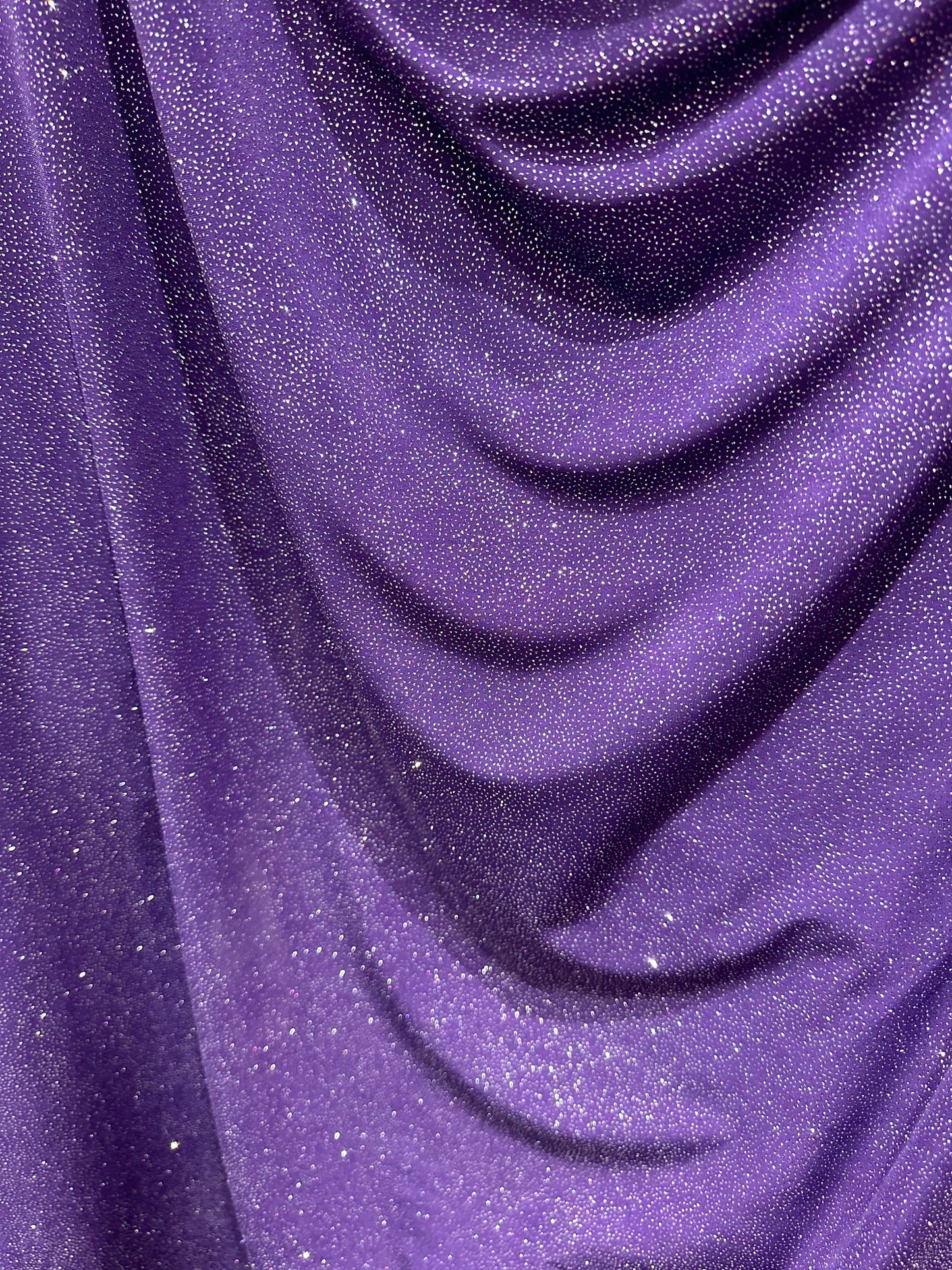 Selena design eggplant/silver poly spandex with glitter 4-way stretch 58/60” Sold by the YD. Ships worldwide from Los Angeles California USA