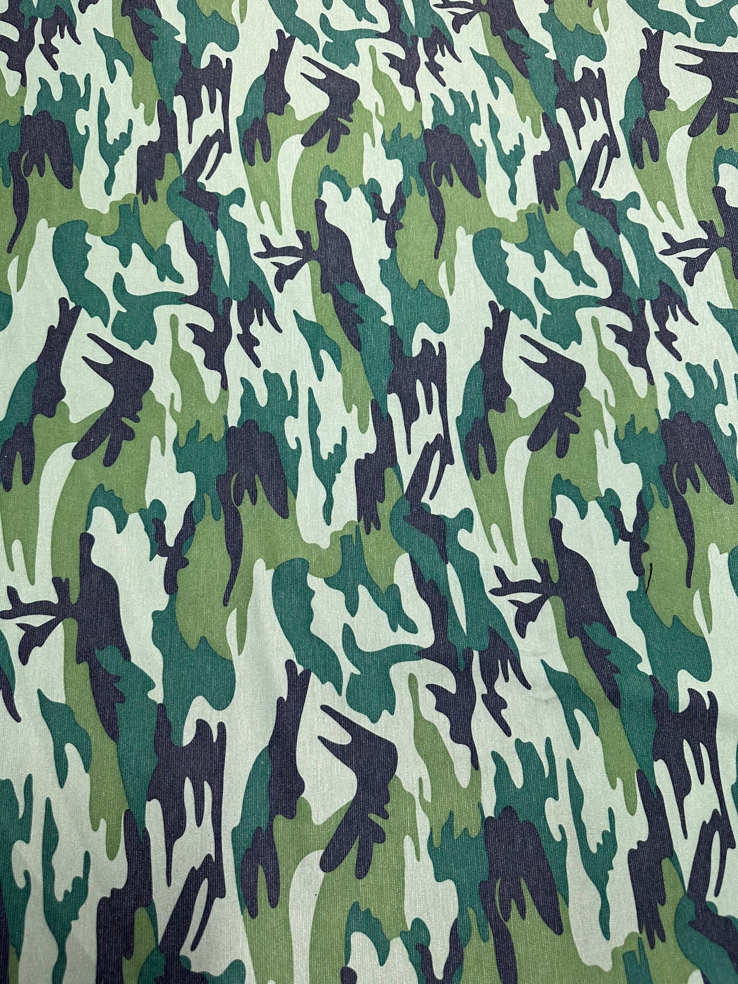 Camouflage design army green print on Poly spandex ponte de Roma 2-way stretch 58/60” Sold by the YD. Ships worldwide from Los Angeles Calif