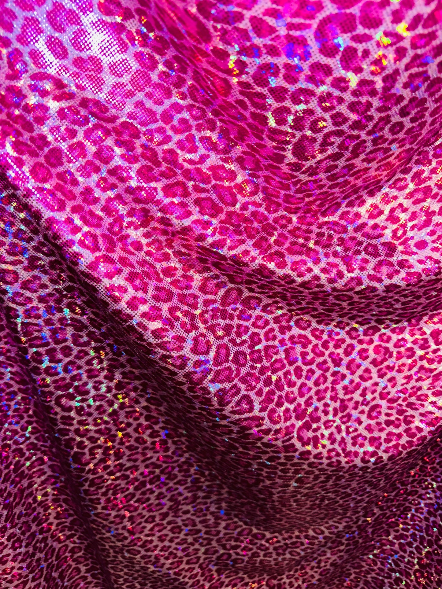 Wild Cheetah design on shattered glass hologram metallic nylon spandex 4-way stretch 58/60” Sold by the YD