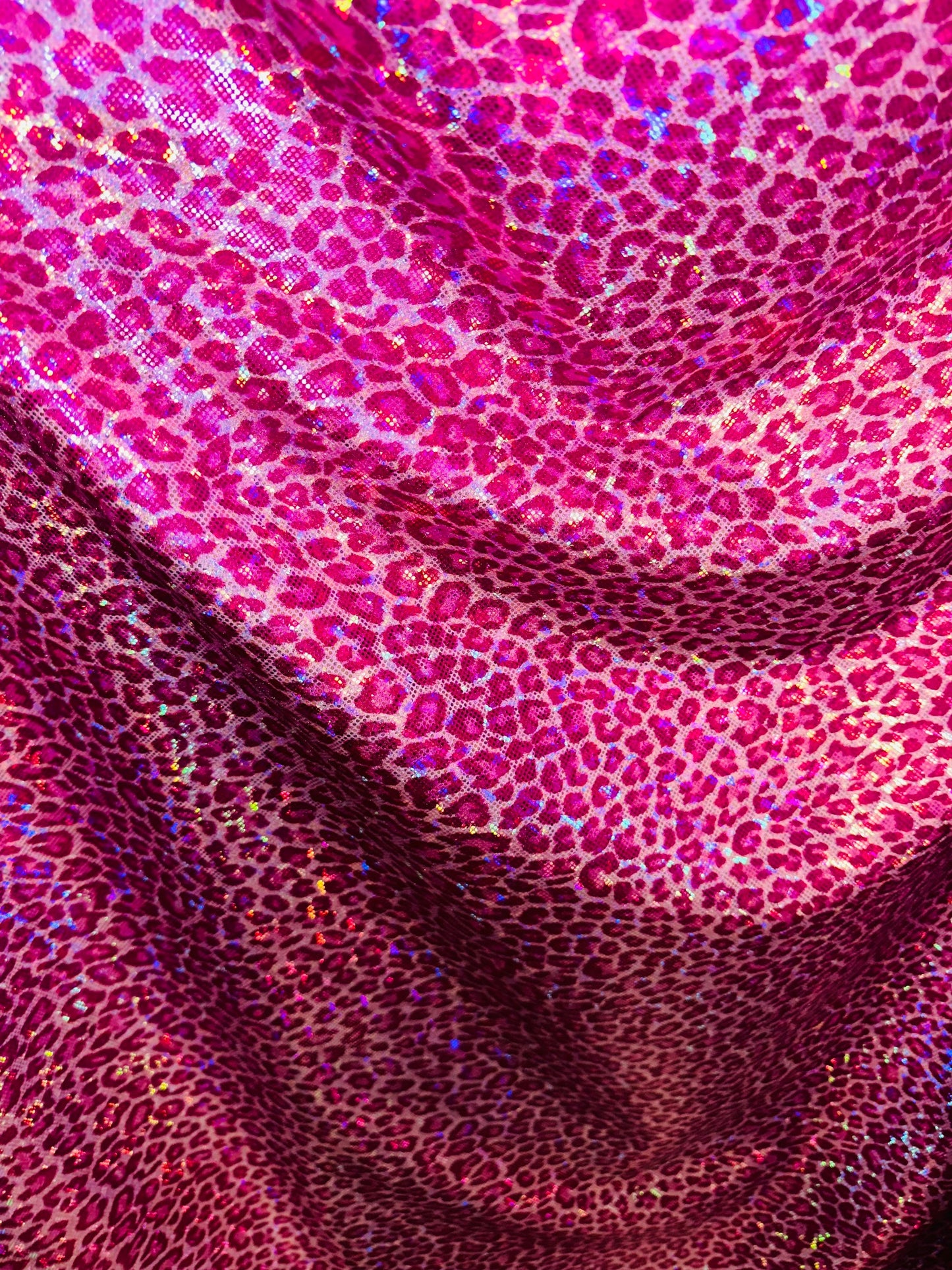 Wild Cheetah design on shattered glass hologram metallic nylon spandex 4-way stretch 58/60” Sold by the YD