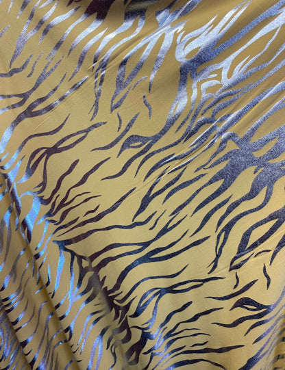 Exotic zebra design metallic poly spandex 4-way stretch 58/60” Sold by the YD. Ships worldwide from Los Angeles California USA