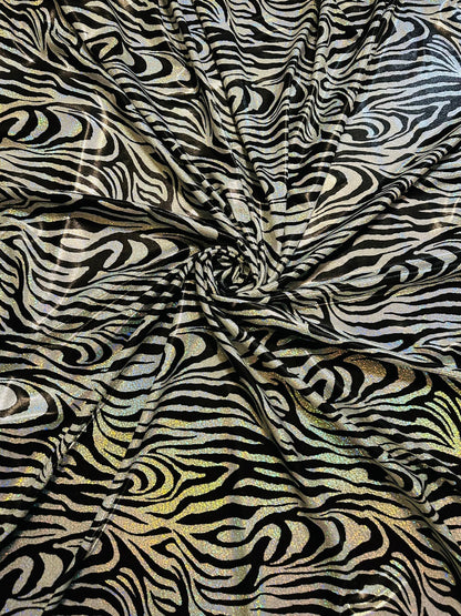 Wild Zebra design hologram metallic nylon spandex with iridescent foggy foil 58/60” 4-way stretch.