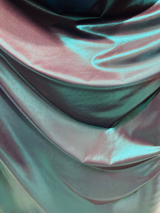Metallic nylon spandex with foggy foil Navy/Teal iridescent foil 4-way stretch 58/60” Sold by the YD. Ships worldwide