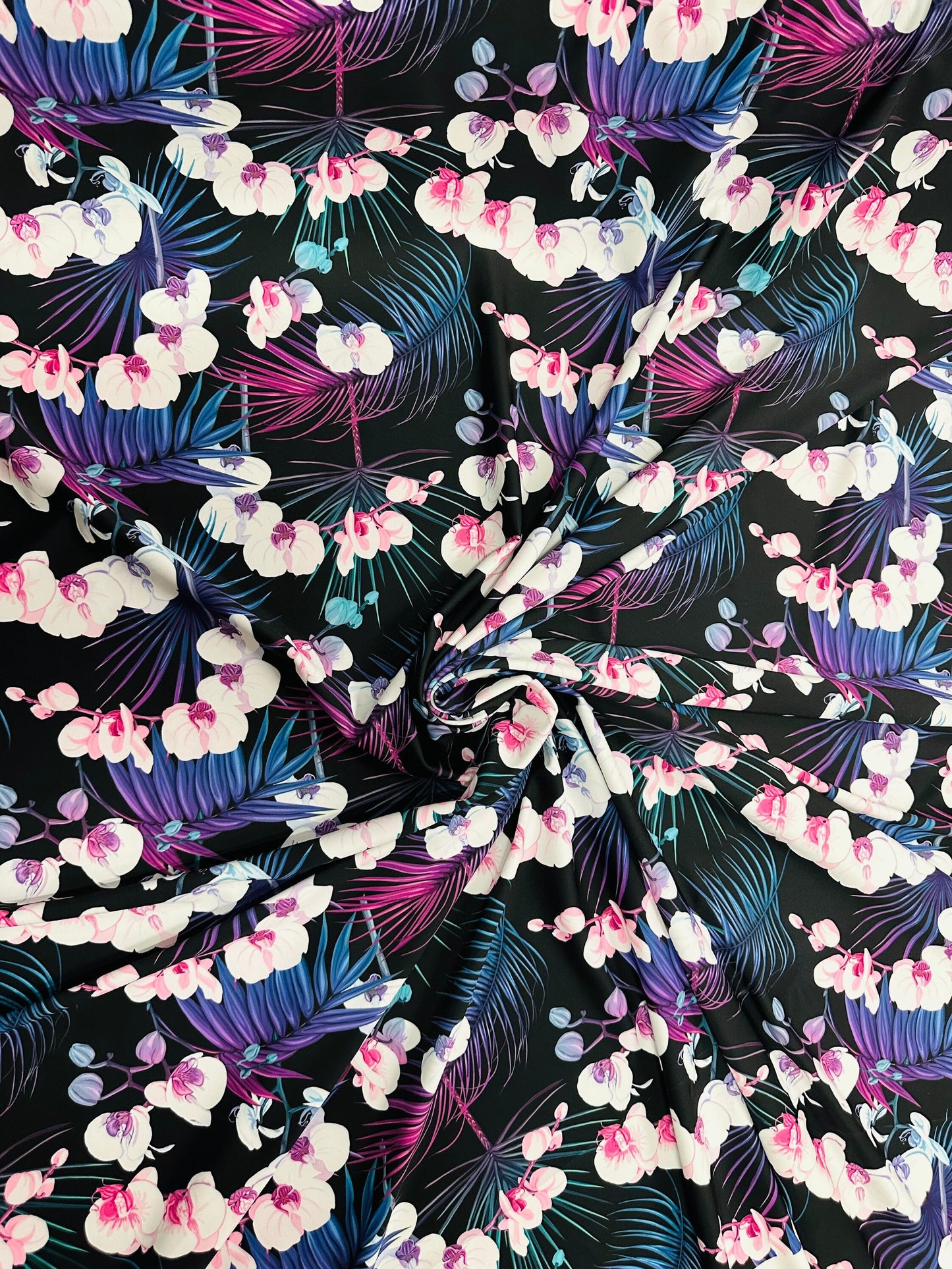 New tropical floral design print on best quality of nylon spandex 4-way stretch 58/60” Sold by the YD.
