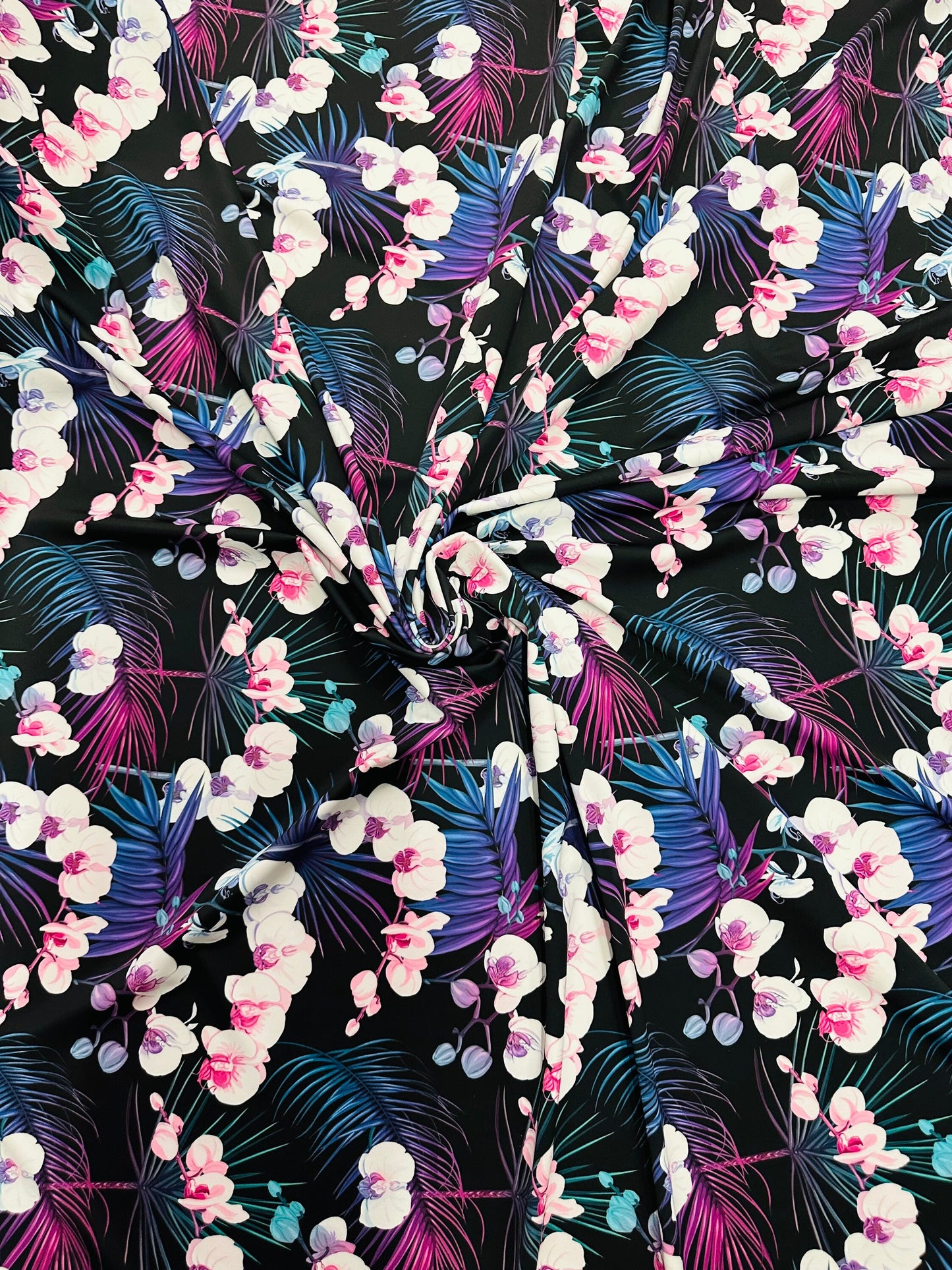 New tropical floral design print on best quality of nylon spandex 4-way stretch 58/60” Sold by the YD.