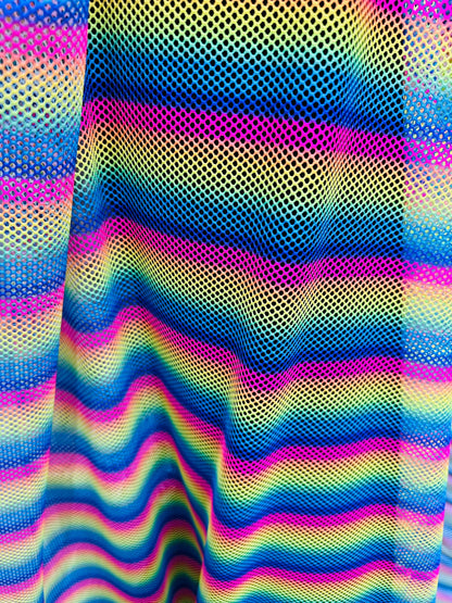 New Rainbow design print on fishnet 2-way stretch 58/60” Sold by the YD.