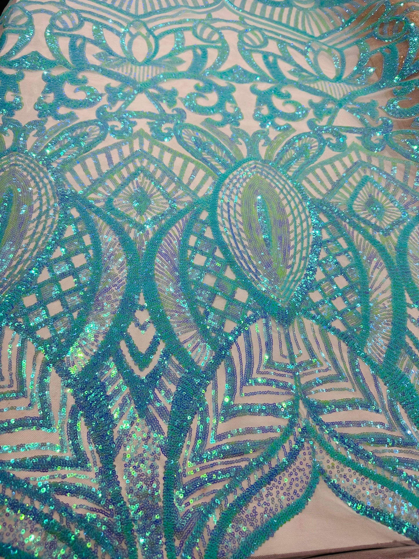 New Luxury Jlo sequins design Tiffany blue embroidered on stretch power mesh  4-way stretch 55/57” Sold by the YD. Ships worldwide from L.A