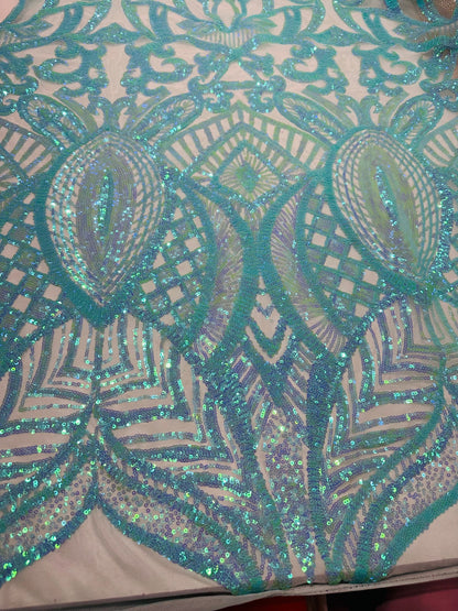 New Luxury Jlo sequins design Tiffany blue embroidered on stretch power mesh  4-way stretch 55/57” Sold by the YD. Ships worldwide from L.A