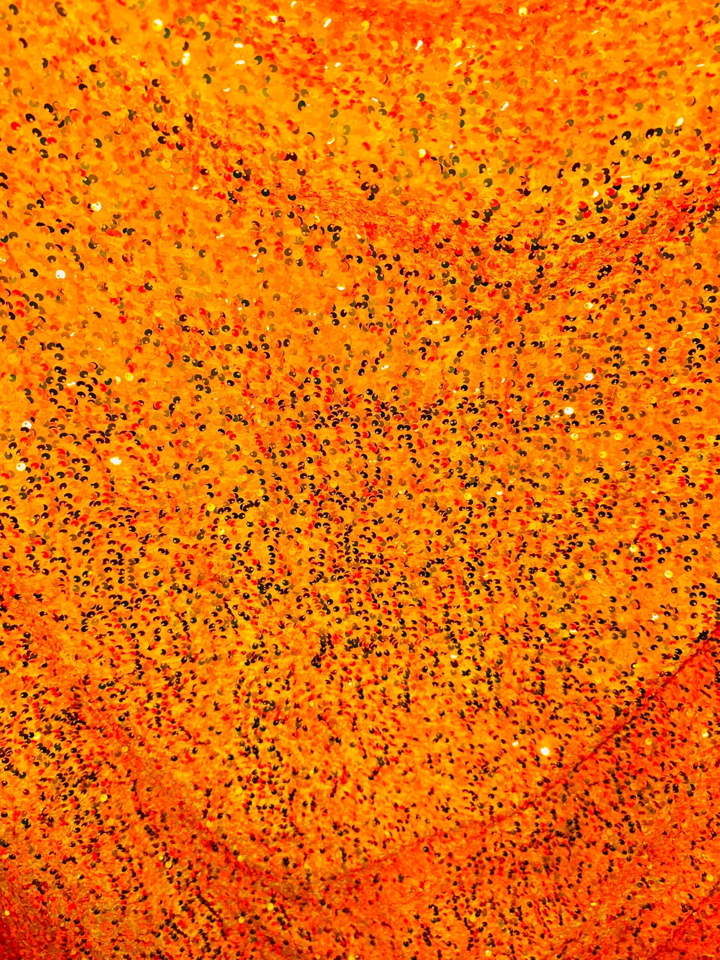 Luxury Iridescent sequins neon orange embroidered on stretch velvet 4-way stretch 58/60” Sold by the YD.