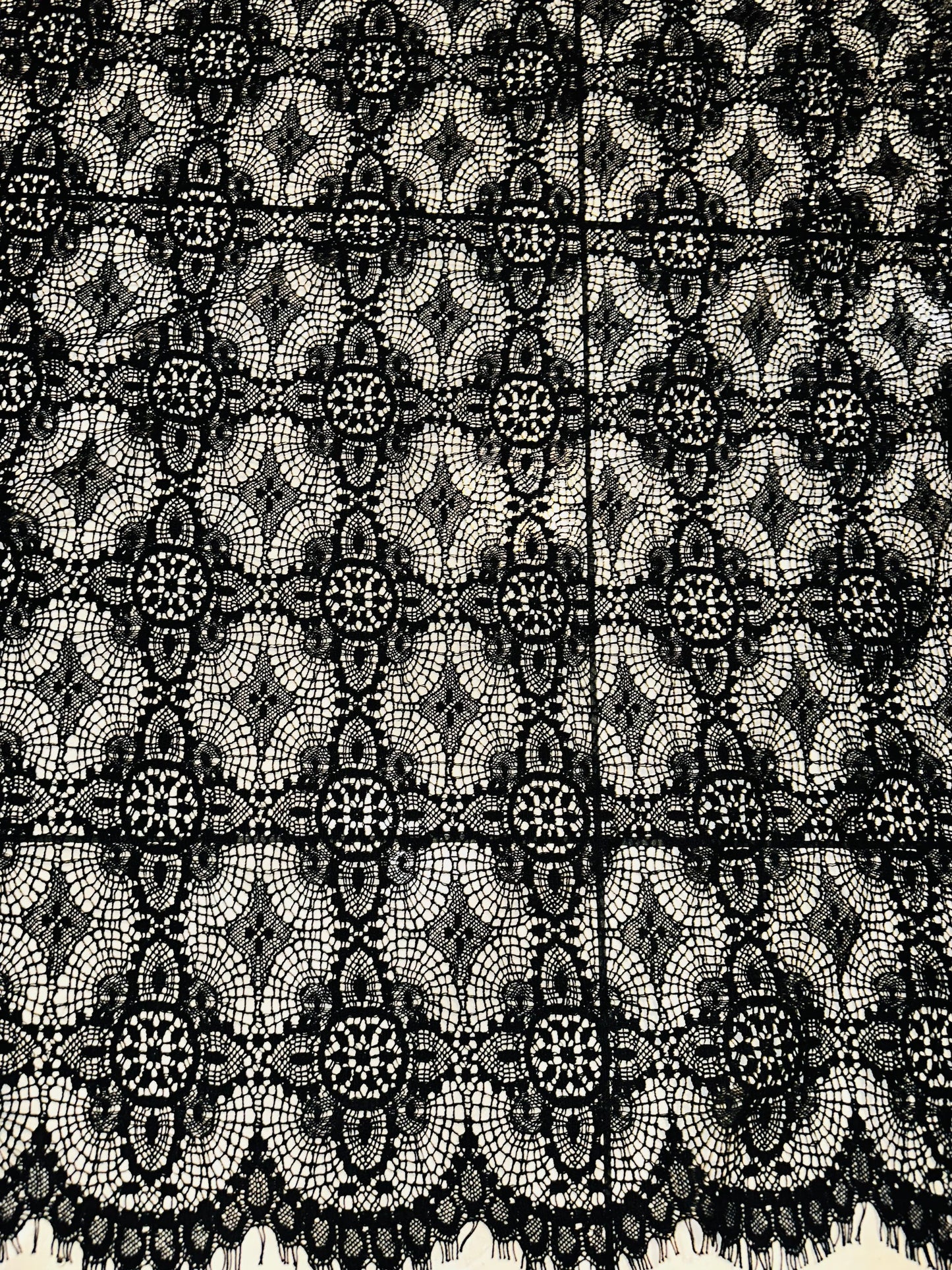 French chantilly lace, Black 36” wide, allover rose abstract design, 2 scallop edges with eyelash fringe. This is an elegant-looking lace.