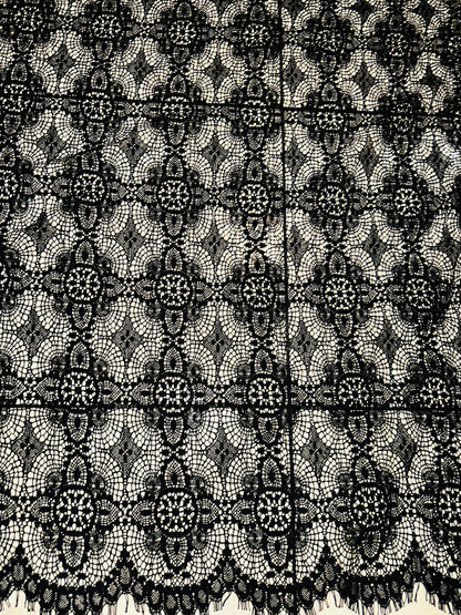 French chantilly lace, Black 36” wide, allover rose abstract design, 2 scallop edges with eyelash fringe. This is an elegant-looking lace.