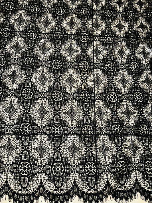 French chantilly lace, Black 36” wide, allover rose abstract design, 2 scallop edges with eyelash fringe. This is an elegant-looking lace.