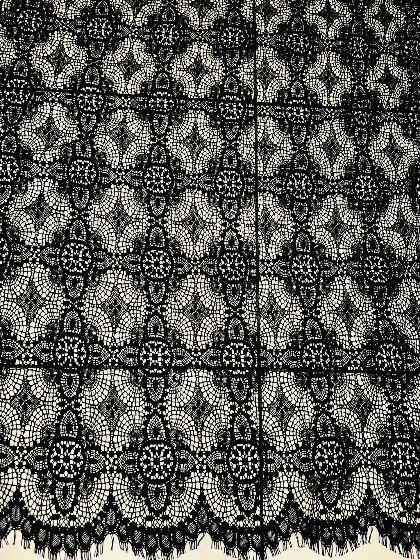 French chantilly lace, Black 36” wide, allover rose abstract design, 2 scallop edges with eyelash fringe. This is an elegant-looking lace.