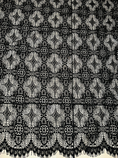 French chantilly lace, Black 36” wide, allover rose abstract design, 2 scallop edges with eyelash fringe. This is an elegant-looking lace.