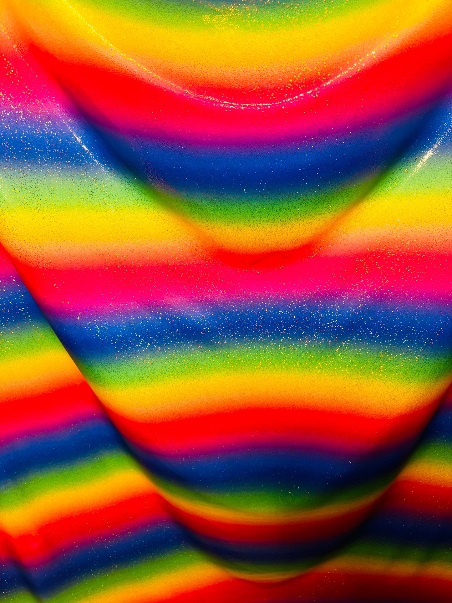 Rainbow design hologram metallic nylon spandex 4-way stretch 58/60” Sold by the YD. Ships worldwide from Los Angeles California USA