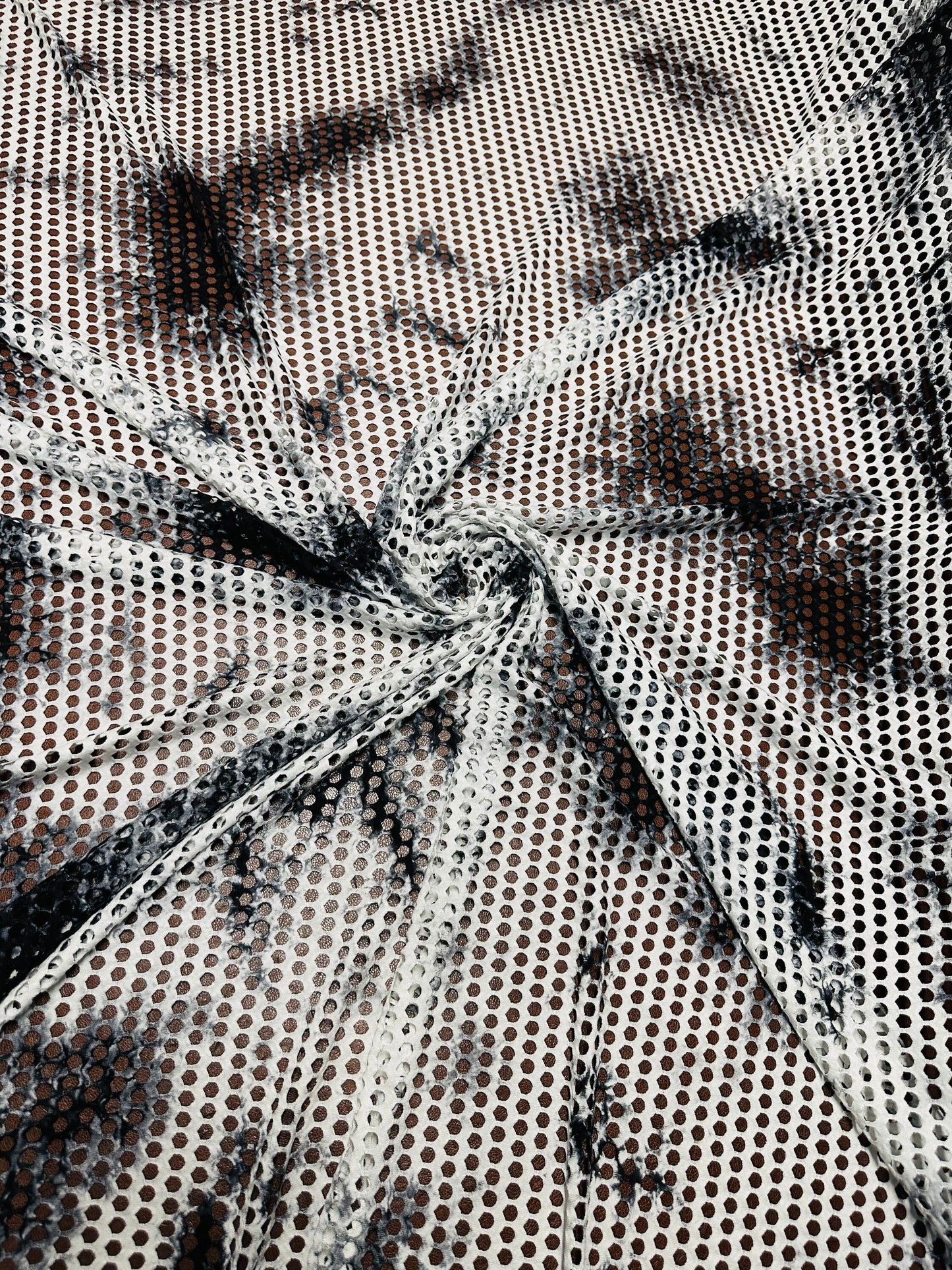 New Tye Dye fishnet white/black  nylon spandex 4-way stretch 58/60” Sold by the YD.