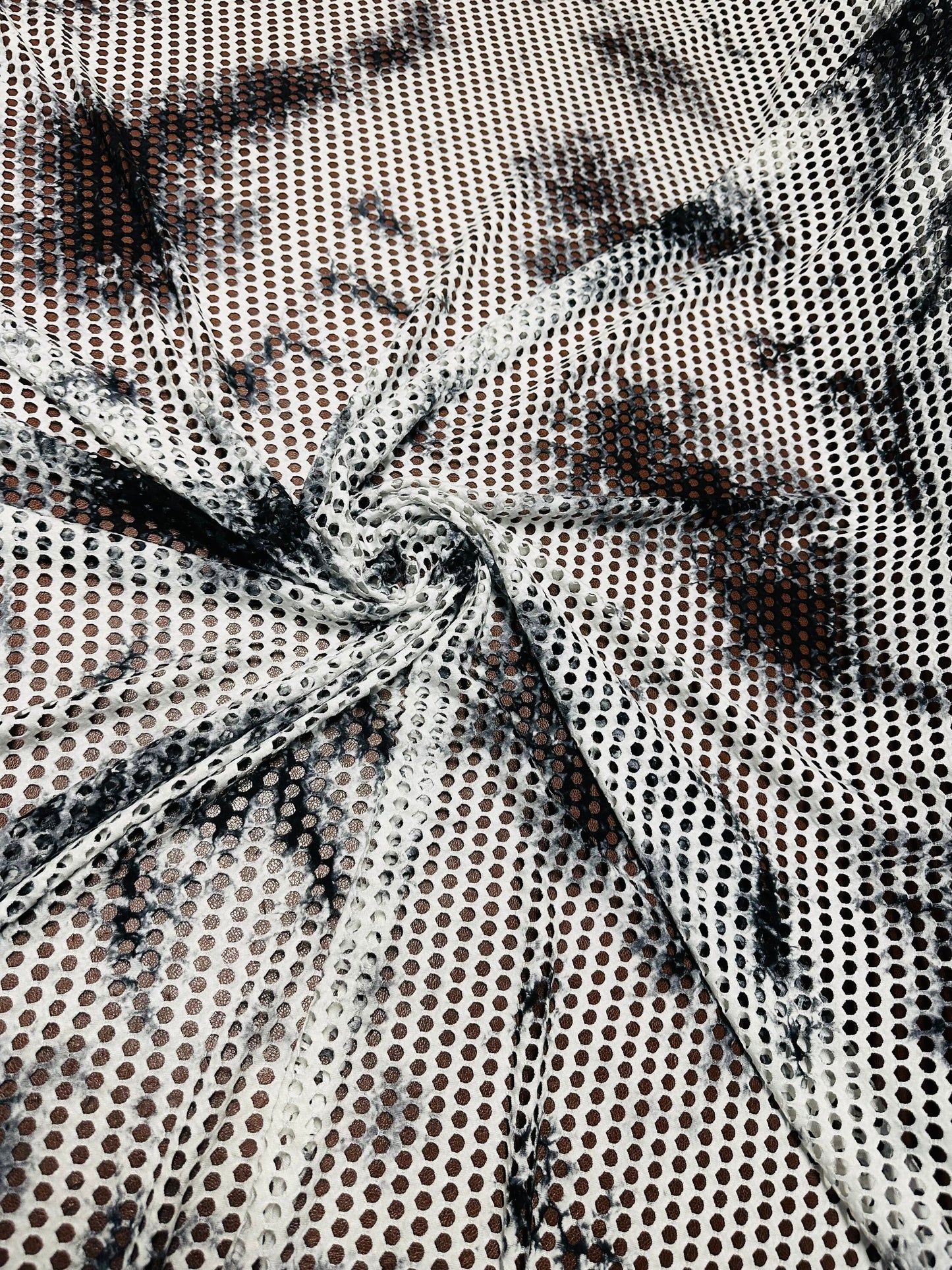 New Tye Dye fishnet white/black  nylon spandex 4-way stretch 58/60” Sold by the YD.