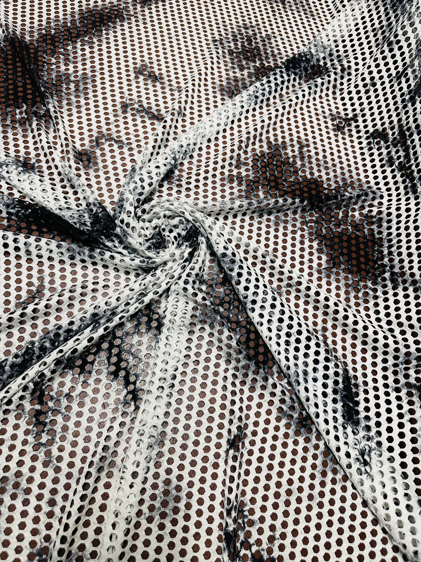 New Tye Dye fishnet white/black  nylon spandex 4-way stretch 58/60” Sold by the YD.