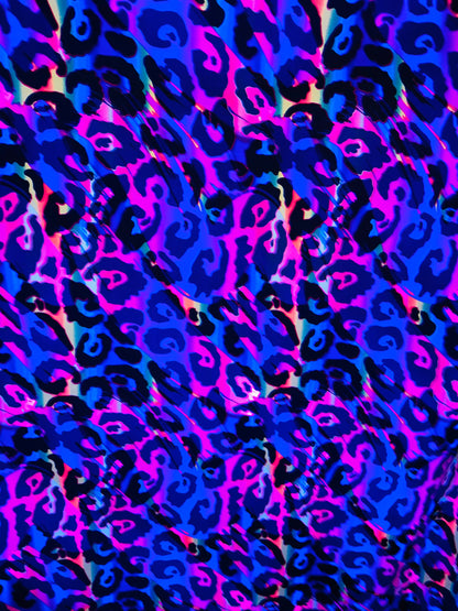 Wildcat  design multicolor print on best quality of nylon spandex 4-way stretch UV light it glows under black light 58/60” Sold by the YD.