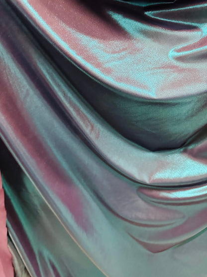 Metallic nylon spandex with foggy foil Navy/Teal iridescent foil 4-way stretch 58/60” Sold by the YD. Ships worldwide